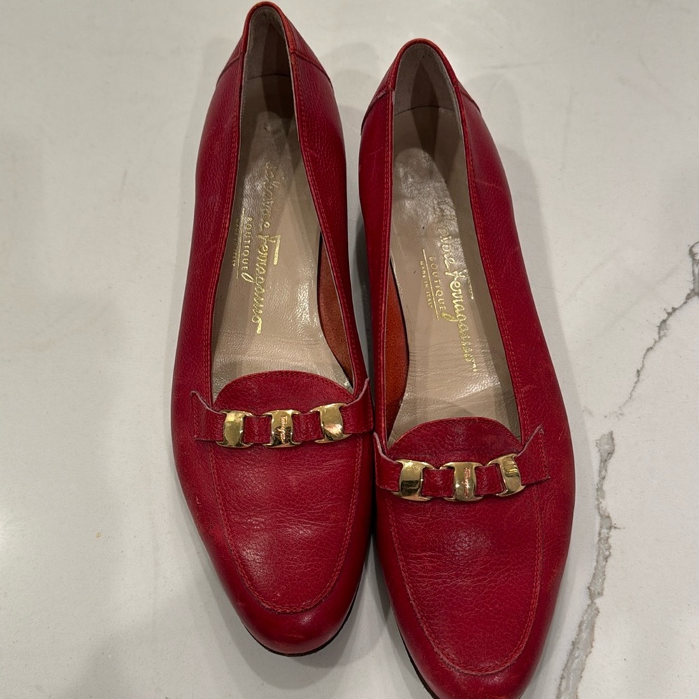 Salvatore Ferragamo Designer red flat shoes with gold buckle in front.  Size 9AA